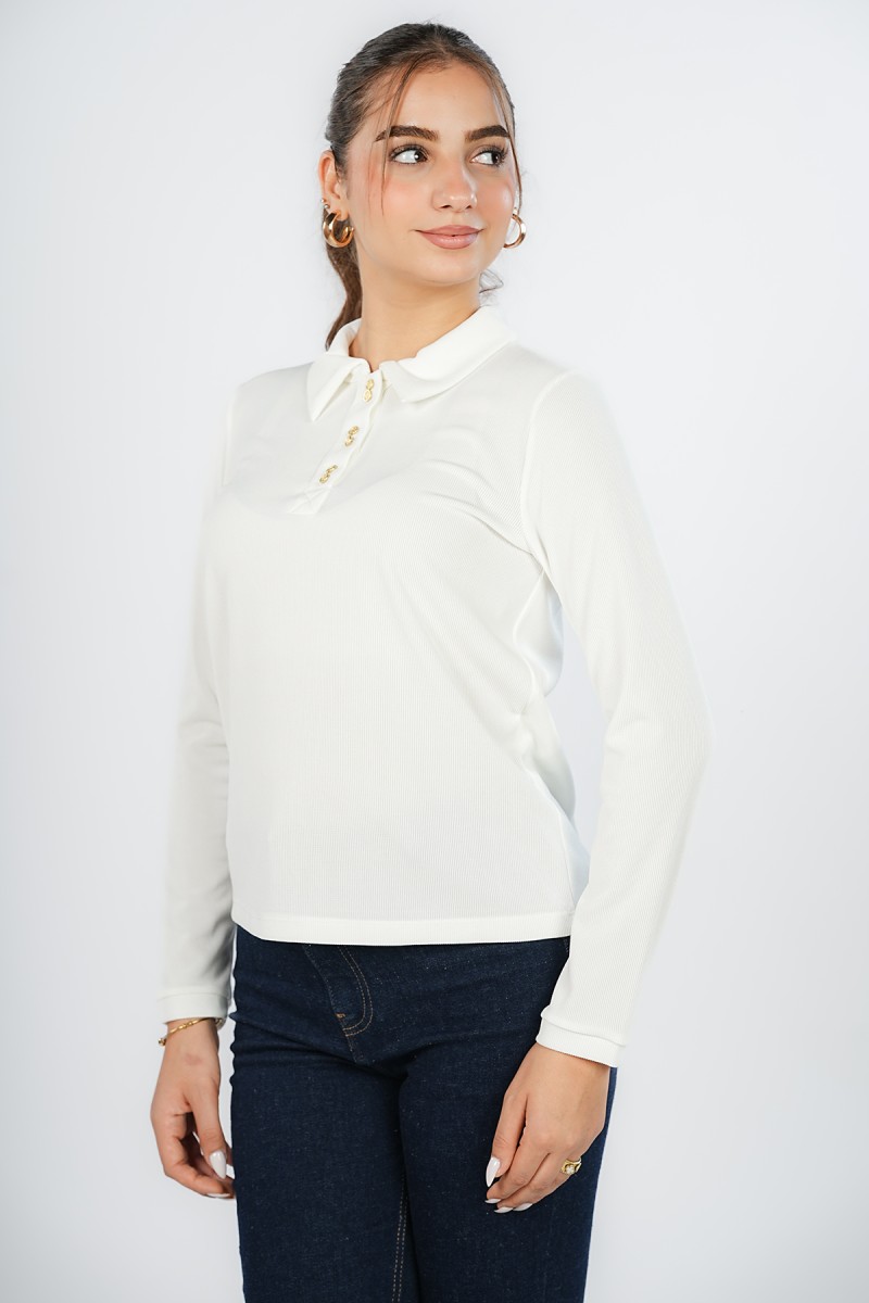 Pull avec boutons dorés